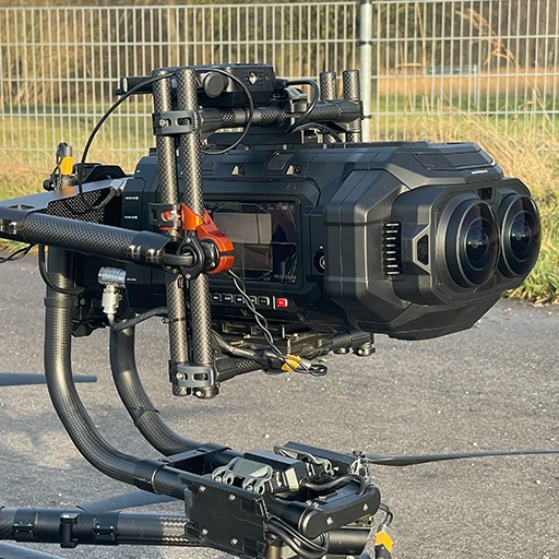 Close-up of the Blackmagic URSA Cine Immersive camera mounted within the carbon fiber cage of a Freefly MōVI Pro gimbal.